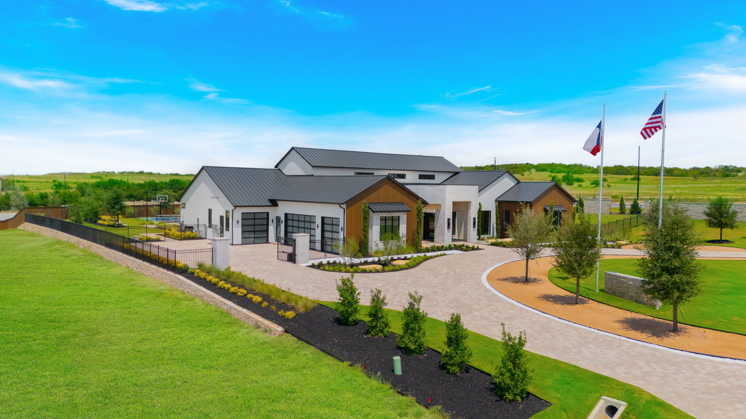 Aerial view of a custom home estate at the close of the page